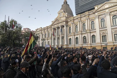 Demonstrators at Plaza Murillo, outside of Palacio Quemado in La Paz, Bolivia, on Wednesday, June 26, 2024. Chanting crowds lit fireworks and punched the air outside Bolivia's presidential palace as rebel soldiers dispersed after a failed coup attempt against the nation's socialist government.