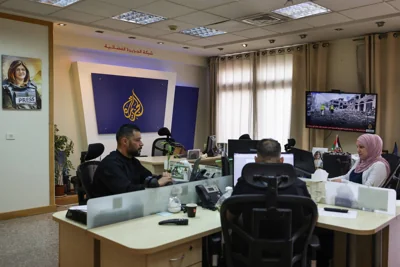 Israeli police raid Al Jazeera offices and order it to close its local operation