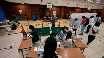 Japan's ruling coalition loses majority, election outcome in balance