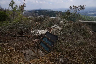 Israeli soldiers display what they say is an entrance to a Hezbollah tunnel found during their ground operation in southern Lebanon, 13 October, 2024 