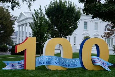 A sign wishing former President Jimmy Carter a happy 100th birthday sits on the North Lawn of the White House in Washington, on Tuesday, Oct. 1, 2024.