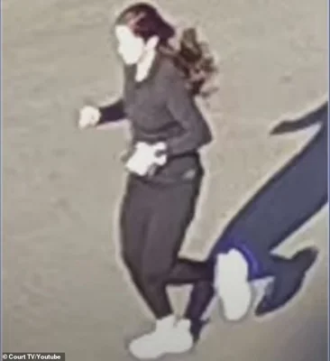 The picture was taken on CCTV cameras near her home on the University of Georgia campus at 9.05am on the day of her death. She was holding her iPhone in her left hand, wearing all black activewear and her noise-canceling AirPods