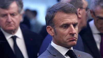French President Emmanauel Macron looking glum