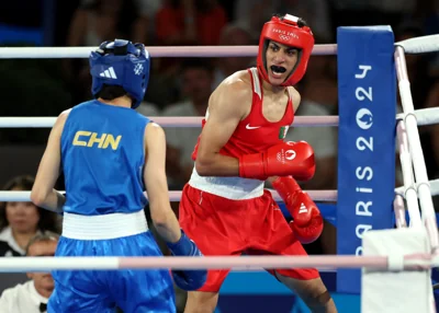 Imane Khelif of Team Algeria looks on against Liu Yang of Team People's Republic of China