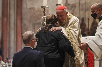 Acutis's parents, Antonia (front) and Andrea (rear) are greeted by Cardinal Agostino Vallini during the beatification ceremony in Assisi, central Italy, in October 2020