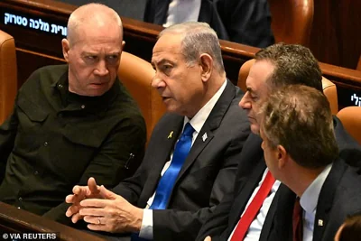 Israeli Prime Minister Benjamin Netanyahu speaks to Defense Minister Yoav Gallant