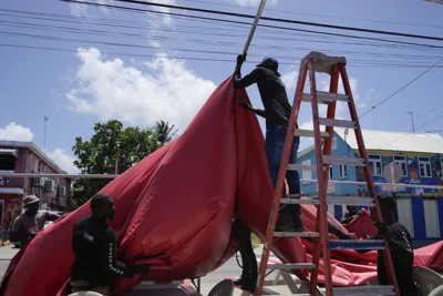 People disassemble a beach bar's awning in preparation for Hurricane Beryl, in Bridgetown, Barbados, Sunday, June 30, 2024. AP PHOTO
