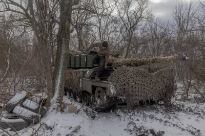 A Ukrainian tank crew member of the 68th Jaeger Brigade stands on a Leopard 1A5 tank at the position where they take a break in fighting, near Pokrovsk, the eastern Donetsk region, on December 13, 2024, amid the Russian invasion of Ukraine. AFP PHOTO