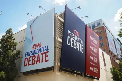 Signs on the side of the CNN headquarters advertises the presidential debate.