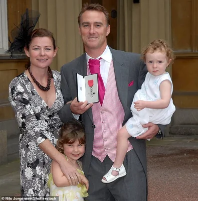 Graham would find love again with his second wife Amanda. Pictured here with their daughters Kitty and Emma (in 2007 after getting his MBE). Thorpe is survived by her and his four children