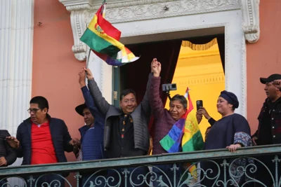 President of Bolivia Luis Arce Catacora (C) speaks on the balcony of Palacio Quemado after a press conference