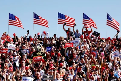 Attendees participate in the pledge of allegiance during the preprogram for a campaign rally for Republican presidential candidate, former U.S. President Donald Trump at the Butler Farm Show Inc. on October 05, 2024 in Butler, Pennsylvania. Trump is returning to Butler, Pennsylvania for the first time since his last rally there where an assassination attempt took place. (Photo by Anna Moneymaker/Getty Images)