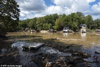 Milton is projected to bring an intimidating 12 inches of rain which could inundate the already struggling Florida region with many still recovering from intense flooding and winds that topped 140 mph. Pictured: Pieces of a destroyed dock are seen in Lake Lure, North Carolina on October 2