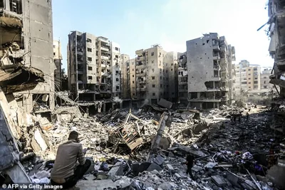 People check buildings levelled on September 27 by Israeli strikes that killed Nasrallah