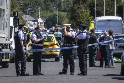 Police secure the area, where a man has been detained and a knife has been seized after a number of people were injured in a reported stabbing, in Southport, Merseyside, England, Monday July 29, 2024. PHOTO BY JAMES SPEAKMAN/PA VIA AP 