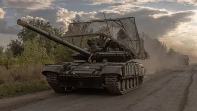 Ukrainian servicemen drive Soviet-made T-64 tanks in the Sumy region, near the border with Russia, on August 11, 2024