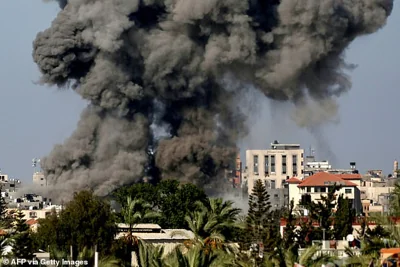 Smoke billows over Nuseirat in the central Gaza Strip amid the Israeli offensive, on August 11