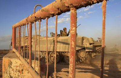 An Israeli armoured vehicle enters the Philadelphi Corridor near the Palestinian town of Rafah in southern Gaza, October 19, 2006