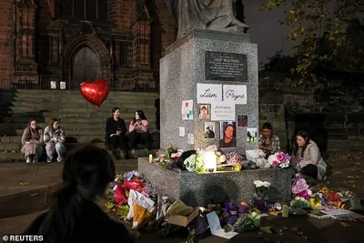 Tributes and flowers are placed outside St. Peter's collegiate church to remember former One Direction singer Liam Payne, in Wolverhampton