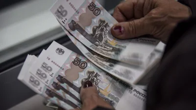 Russian central bank intervenes as ruble tumbles past 110 to the U.S. dollar