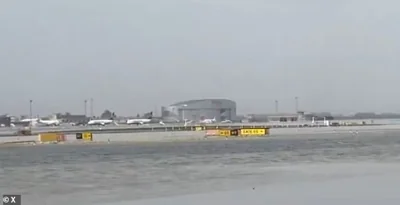 Floodwaters are seen on the runway at El Prat airport in Barcelona, with flights being diverted