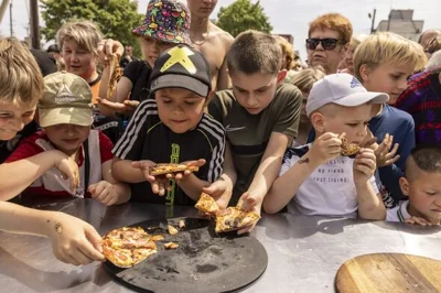 Kids with pizza, Izyum Ukraine