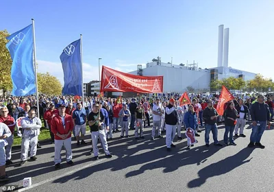 Volkswagen employees gather at the factory gate in Zwickau as the company's works council confirmed that Europe's biggest car maker plans to close at least three plants in Germany