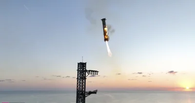 In an engineering feat, mechanical SpaceX arms catch Starship rocket booster back at the launch pad