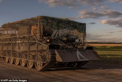 Ukrainian servicemen operate an armoured military vehicle in the Sumy region, near the border with Russia, on August 12, 2024, amid the Russian invasion of Ukraine