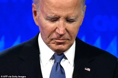 Joe Biden looks down as he participates in the first presidential debate of the 2024 election