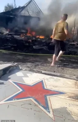 The wreckage of the Okhotnik is seen lying on the ground after impacting a small building in Kostyantynivka