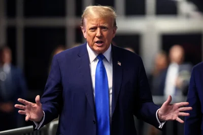 Former President Donald Trump speaks to the media as he leaves court during his trial for allegedly covering up hush money payments at Manhattan Criminal Court on April 22 in New York City