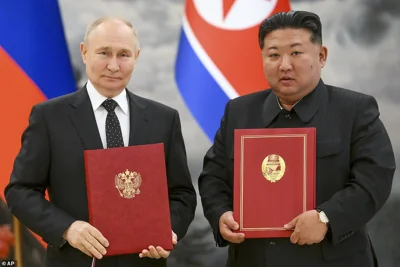 Russian President Vladimir Putin, left, and North Korea's leader Kim Jong Un pose for a photo during a signing ceremony of the new partnership in Pyongyang, North Korea, on June 19, 2024