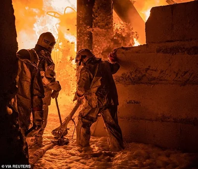 Rescuers work at the site of a Russian drone strike, amid Russia's attack on Ukraine, in Ternopil, Ukraine, in this handout picture released November 26, 2024