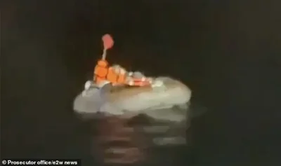 Mikhail is seen calling for help as the fishing boat that rescued him approaches