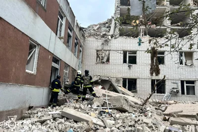 Ukrainian Emergency Service rescuers work at the site of a Russian missile strike in Chernihiv