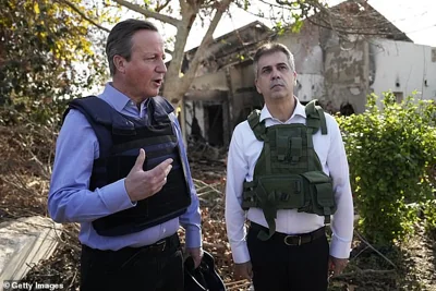 David Cameron during his first trip to Israel as Foreign Secretary back in November. He is pictured visiting kibbutz Be'eri, which was targeted in the October 7 attacks, with then-Foreign Minister Eli Cohen