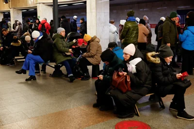 Ukrainians take shelter in an underground train station in Kyiv