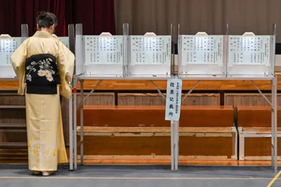 MAKING A CHOICE A woman in a traditional kimono votes during the general election at a polling station in Tokyo on Oct. 27, 2024. AFP PHOTO