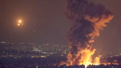 Smoke and flames rise in Beirut's southern suburbs, after Israeli air strikes, amid ongoing hostilities between Hezbollah and Israeli forces, as seen from Sin El Fil