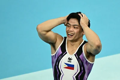 Philippines' Carlos Edriel Yulo celebrates winning the gold medal at the end of the artistic gymnastics men's vault final during the Paris 2024 Olympic Games at the Bercy Arena in Paris, on August 4, 2024. (Photo by Gabriel BOUYS / AFP)