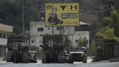 A convoy of Israeli military bulldozers is seen during an army raid in Jenin, West Bank, Monday, Sept. 2, 2024.