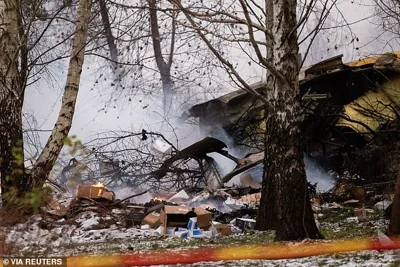 Burning packages and wreckage of the DHL cargo plane are seen at the crash site near Vilnius International Airport, Lithuania November 25, 2024