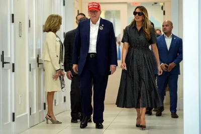 Donald Trump and his wife Melania arrive at a polling location in Palm Beach, Florida, to cast their vote in the US Election