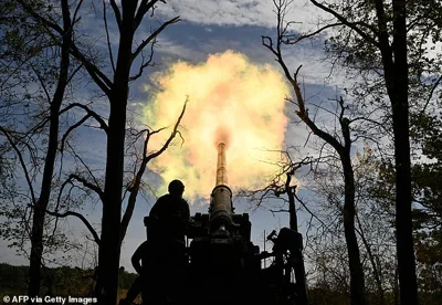 Ukrainian servicemen of the 43 Artillery Brigade fire a 2S7 Pion self-propelled cannon towards Russian positions at a front line in the Donetsk region