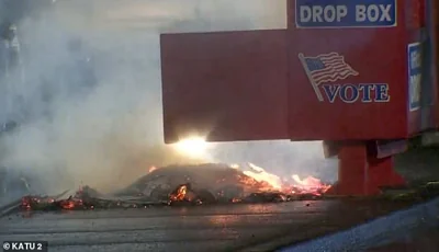 The fire burning at the ballot box in Vancouver, WA early Monday morning. Police say the fire was set by a device placed outside the ballot box which had hundreds of ballots in it at the time