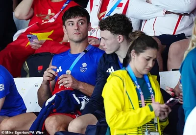 Tom Daley was spotted knitting in the crowd - as he did in Tokyo - but paid full attention