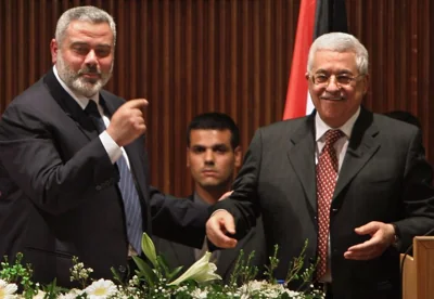 alestinian Prime Minister Ismail Haniyeh from Hamas, left, gestures towards Palestinian Authority President Mahmoud Abbas in Gaza City, 2007.