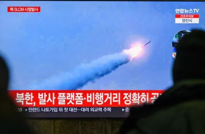 A TV shows a North Korean strategic cruise missile launched from a submarine