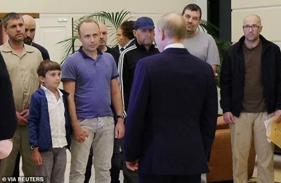 The Russian despot met the eight returnees at Moscow's Vnukovo airport, telling them he 'had not forgotten them, not for a single minute'